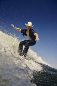 Surfing in Texas Bull riders water sports Wake surfing Texas Clayton Sellers Najiah Knight Rodeo life What's Your Rush campaign Ariat