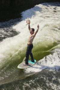 Surfing in Texas Bull riders water sports Wake surfing Texas Clayton Sellers Najiah Knight Rodeo life What's Your Rush campaign Ariat