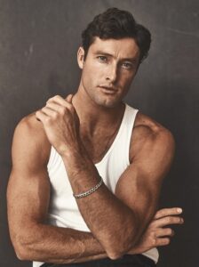 Professional portrait of Doug with a striking pose, emphasizing their poise and elegance.