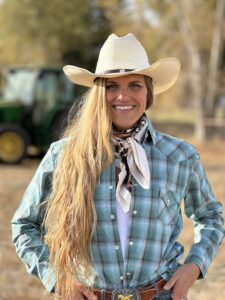 Lacey in a vibrant outdoor setting, dressed casually, highlighting their approachable and versatile style.