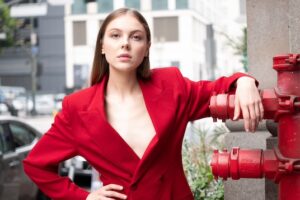 Payton G in an urban backdrop, showcasing their modern and trendy look for commercial modeling.